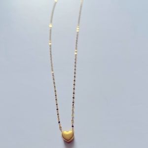 18k gold heart necklace.